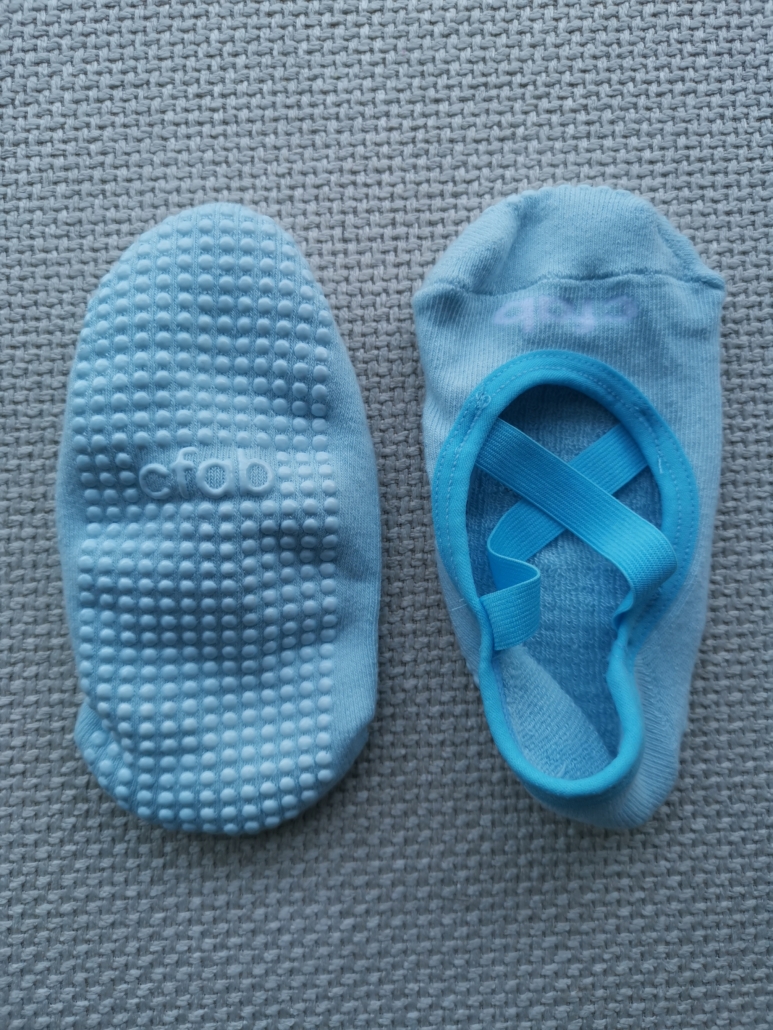 bottom and top views of the custom pilates no-show socks with X belts