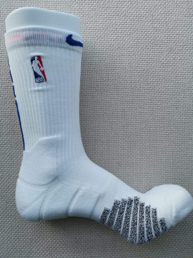 custom NBA high-performance sock with random padding zones for support and cushion. Mesh zones on back of sole, seamless toe. Anti-slip yarns on sole. Embroidery logo on top
