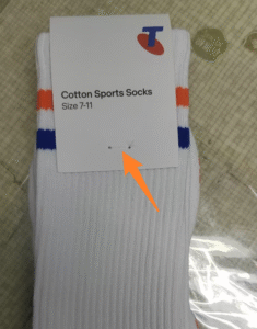 socks with custom header tags with thread stitching attachment